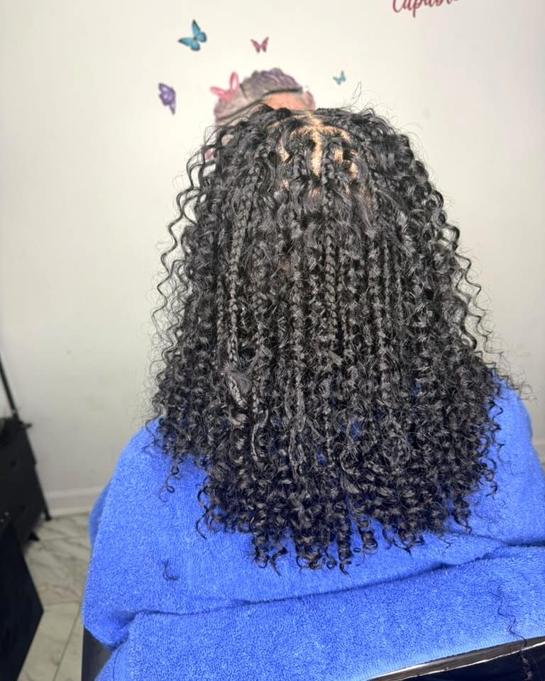 Bohemian knotless braids with loose curls, back view